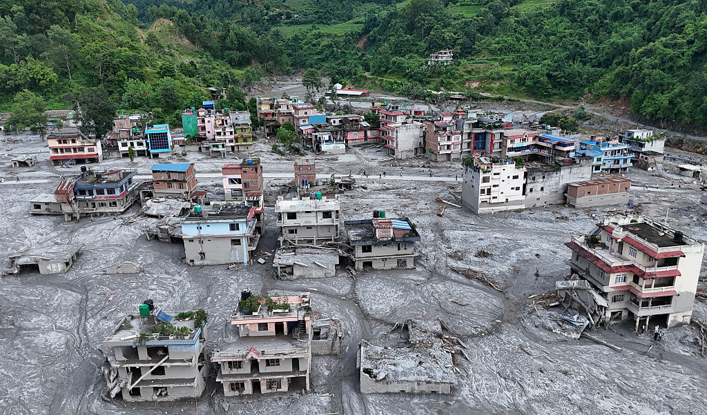 Debris and mud cover buildings in DevGhat village in Nepal (Ritesh Shukla/Getty Images)
