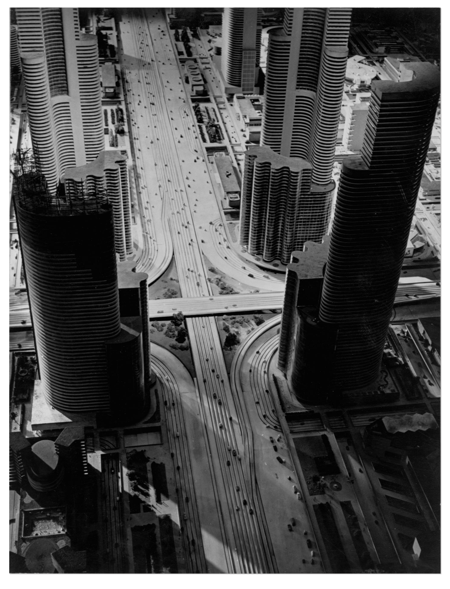 Photo of futuristic model city, featuring tiny cars and skyscrapers