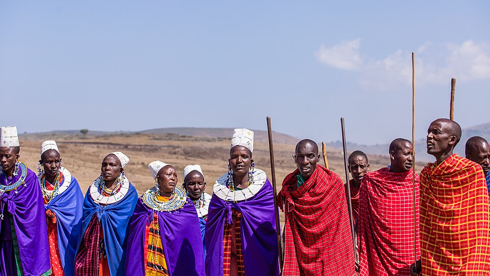 Maasai dancers in the Ngorongoro Conservation Area, Tanzania 01.jpg — "Maasai dancers in the Ngorongoro Conservation Area, Tanzania 01.jpg" by Rwebogora, CC BY-SA 4.0, via Wikimedia Commons