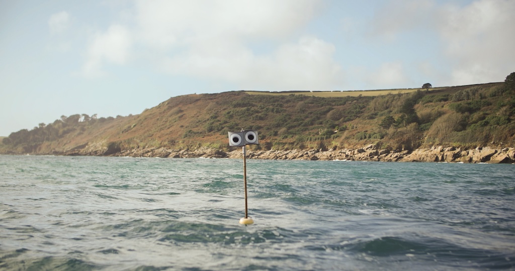 A fishing boat in England uses a “scarecrow” bouy to deter birds from the nets. Image courtesy of Nina Constable