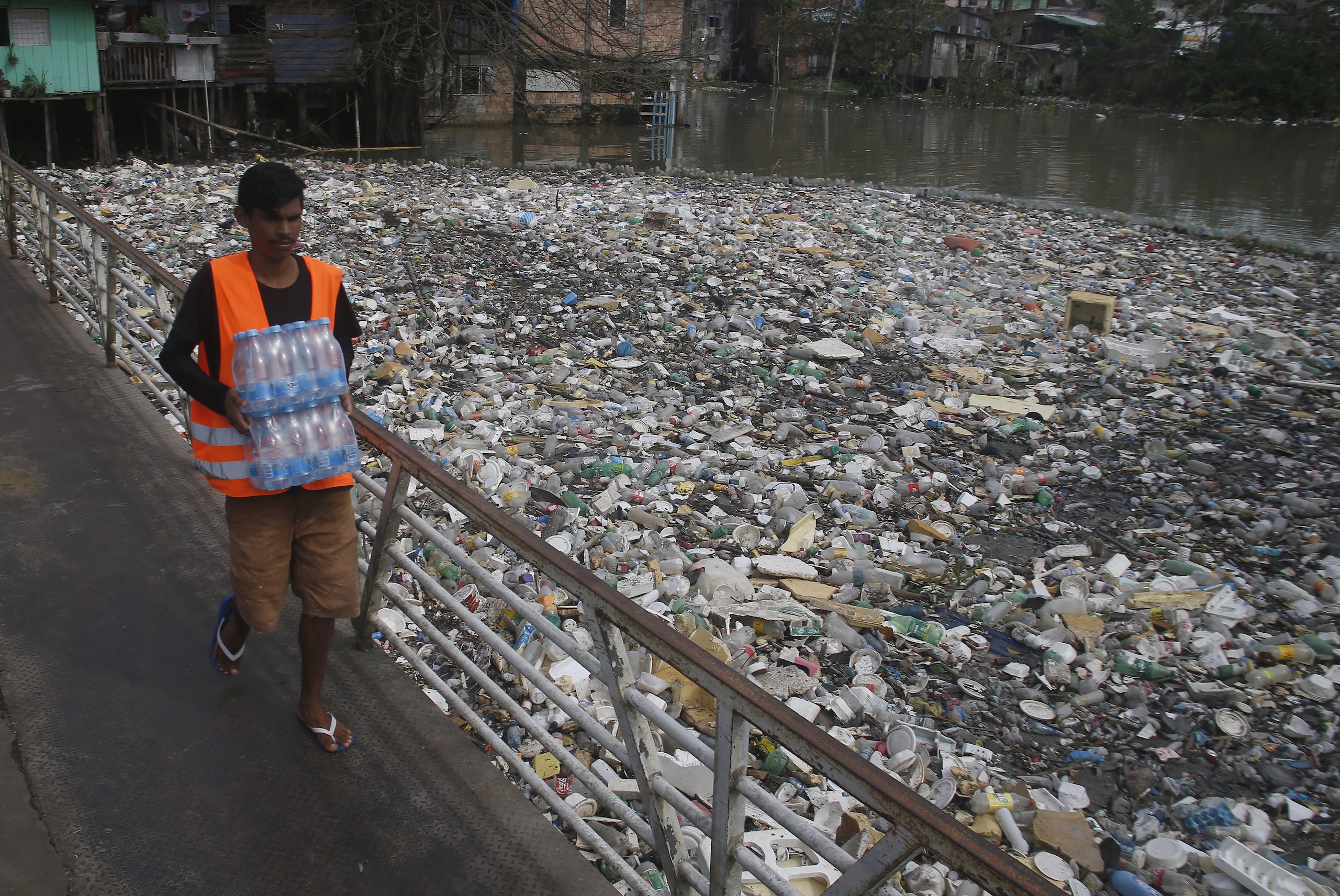 Trash in the Rio Negro, in Manaus, during a flood in June 2022. Image by Edmar Barros/AP Photo.