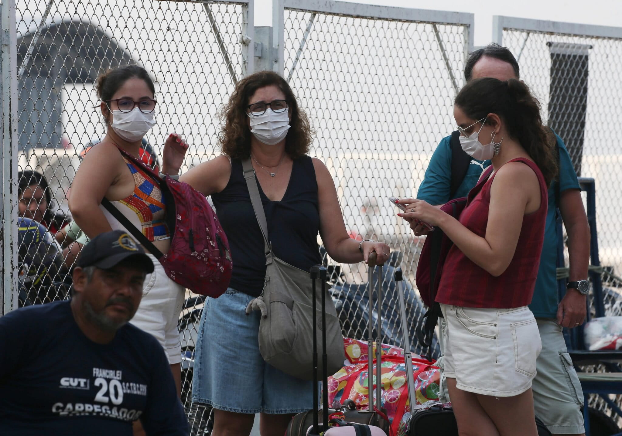 A group of women wear masks to protect themselves from smoke caused by wildfires in Manaus, Amazonas state, Brazil, Friday, Oct. 9, 2026. Image by AP Photo/Edmar Barros.