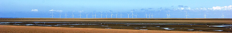 Merseyside banner wind turbines.jpg — "Merseyside banner wind turbines.jpg" by Simon Harrod, CC BY 2.0, via Wikimedia Commons