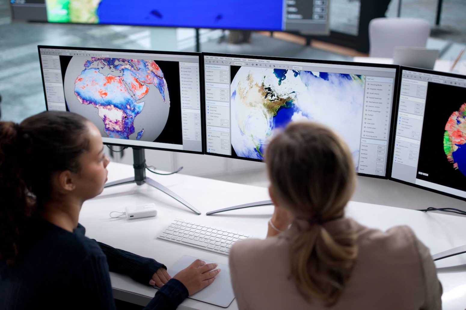 Computer screens displaying weather patterns. Credit: Andriy Popov / Alamy Stock Photo