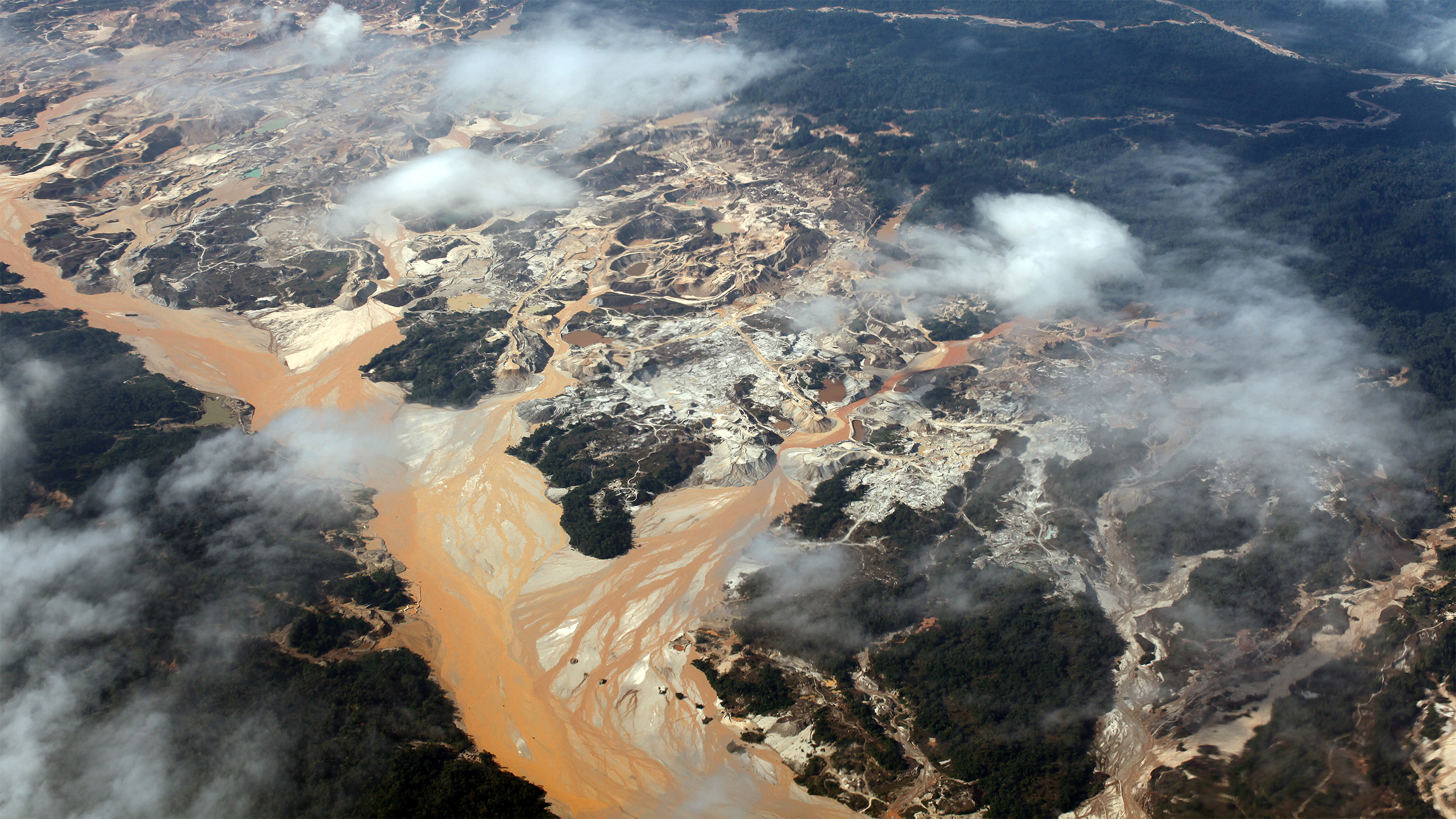 Overhead view of the Rio Huaypetue gold mine in the Peruvian Amazon. Image by Rhett A. Butler/Mongabay.