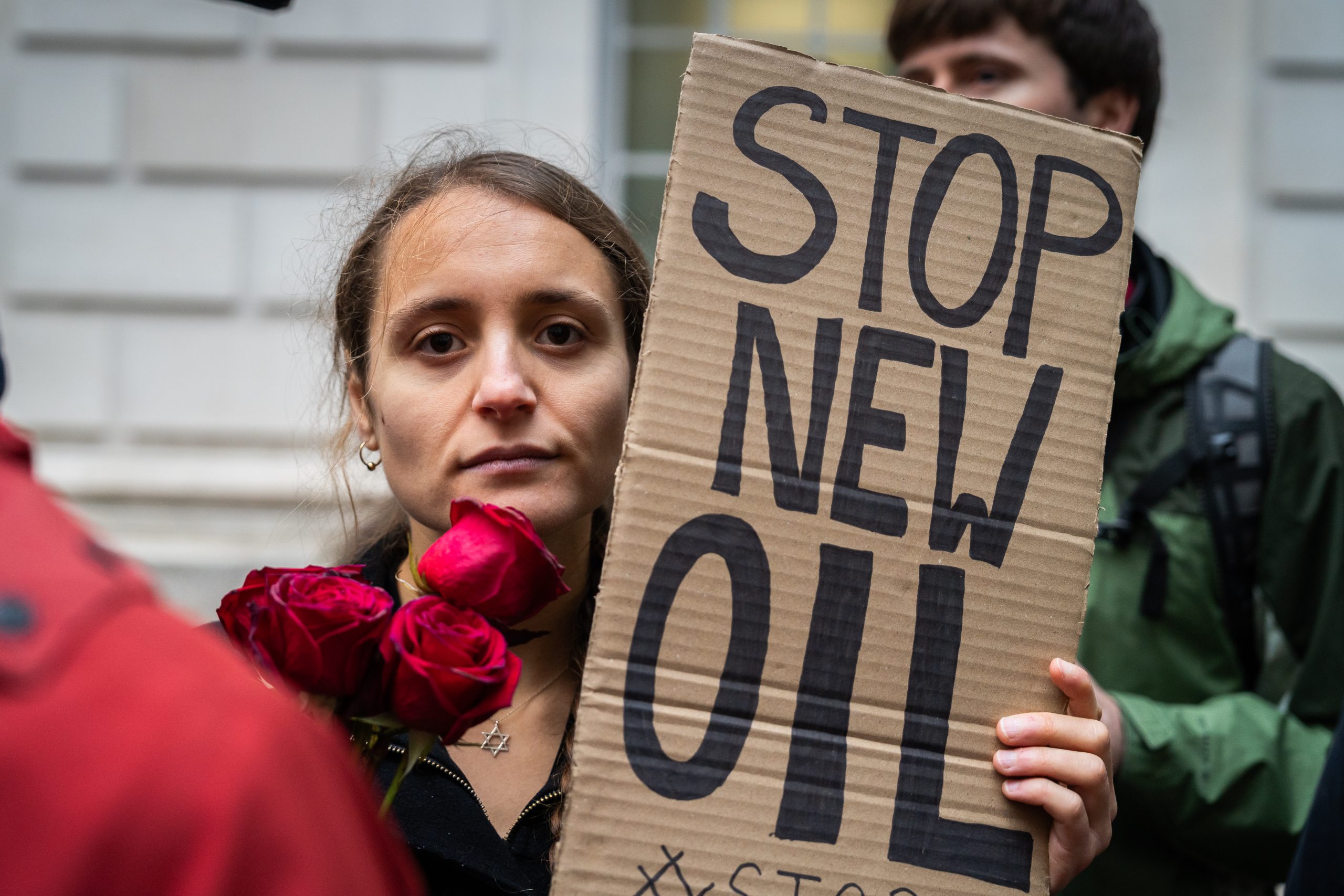 A protester outside the Department for Energy Security and Net Zero on 21 October (Photo: Fossil Free London)