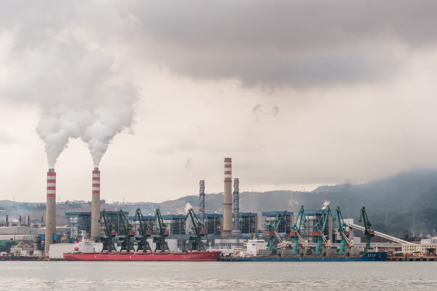 A smelter emits smoke from burning coal to refine nickel at the mining industry owned by Indonesia Weda Bay Industrial Park (IWIP) in Weda Bay, on Halmahera Island, North Maluku, Indonesia, on August 14, 2024. (Photo by Muhammad Fauzy/NurPhoto) — Image via Climate Home News