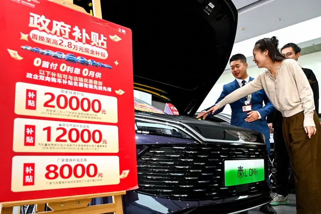 Citizens purchase new energy vehicles through a trade in promotion event at a BYD 4S dealership in Nanchang, Jiangxi province. Credit: Cynthia Lee / Alamy Stock Photo