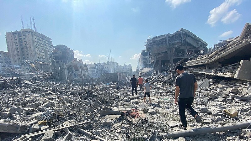 Palestinians inspect the damage following an Israeli airstrike on the El-Remal aera in Gaza City on October 9, 2023. (Photo: Naaman Omar apaimages)
